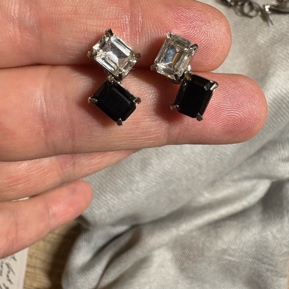 Black and clear rhinestone post earrings in a silver tone setting